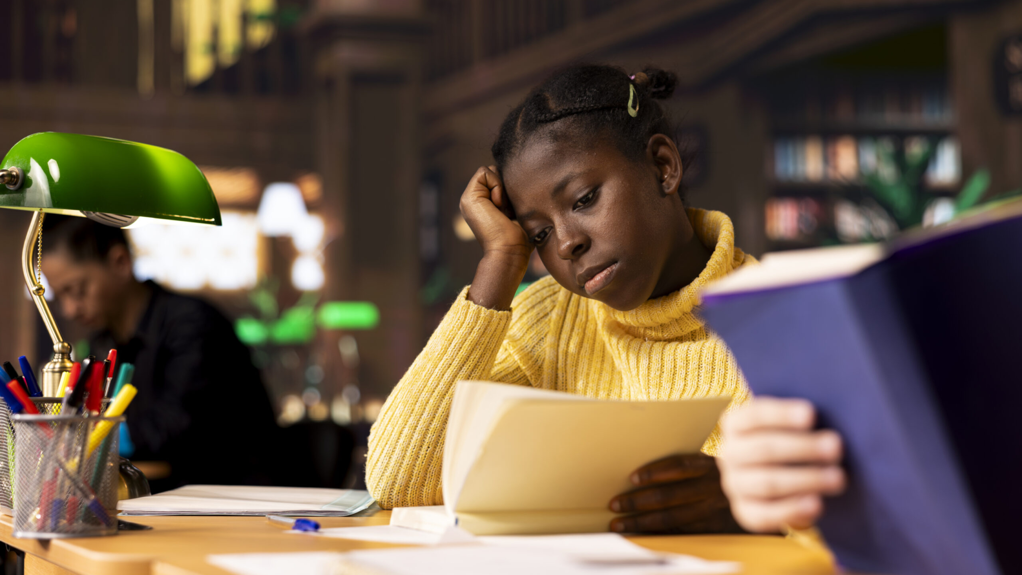 Diverse teenagers pupils in a library reading books for a school assignment, focusing on curriculum based knowledge and literary exploration. Young girls enjoy required literature.